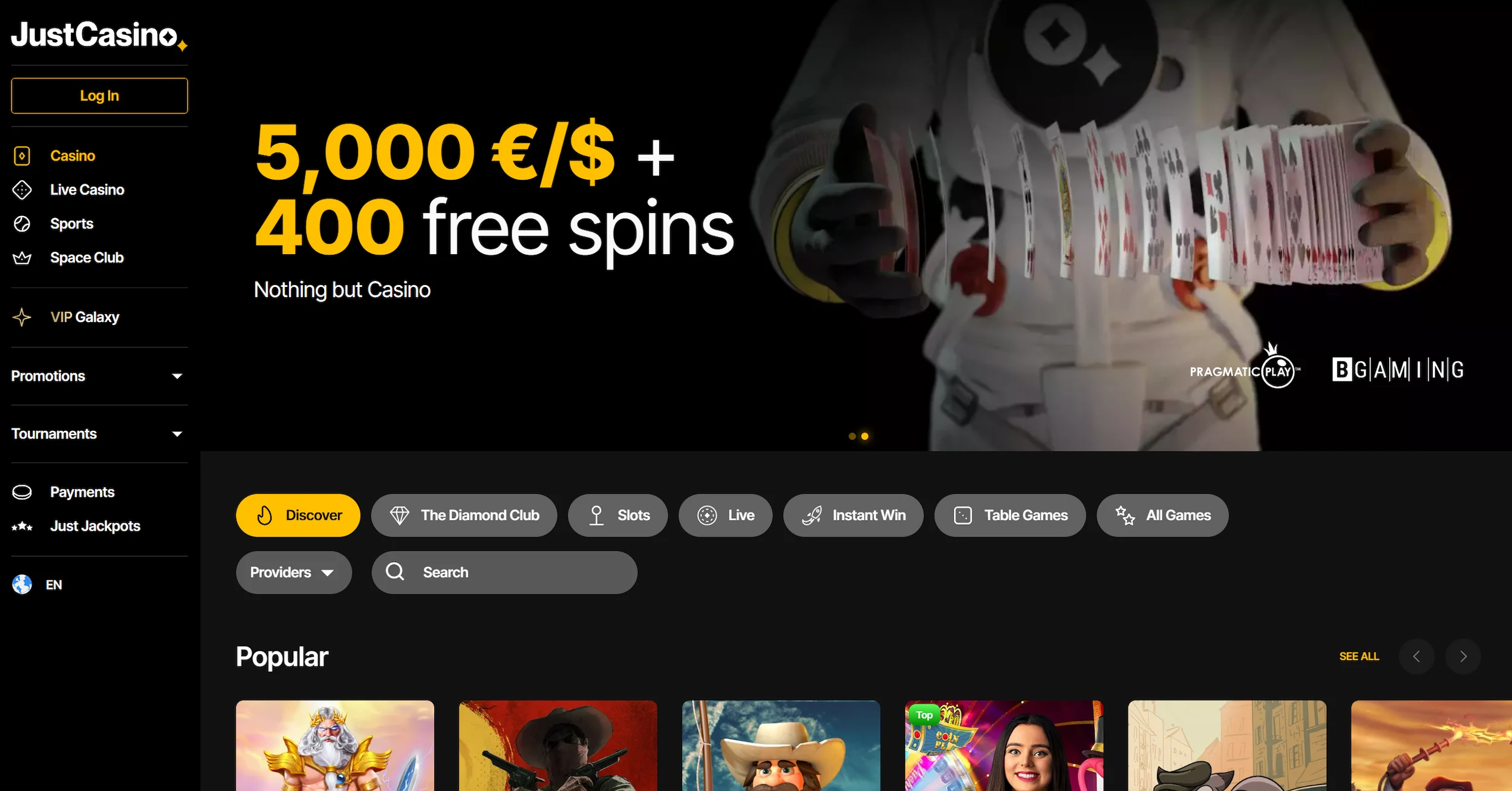 JustCasino frontpage showing bonus offer, popular online pokies and site navigation